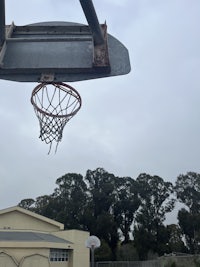 a basketball hoop on a cloudy day