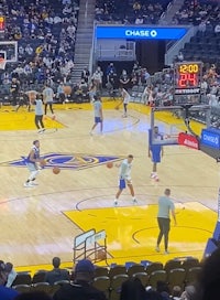 the golden state warriors are playing basketball in a stadium