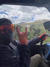 a man sitting in the driver's seat of a vehicle