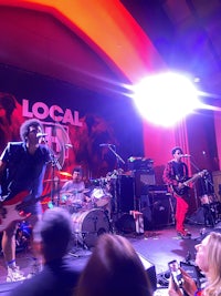 a band performs on stage at a local festival