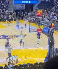 a basketball game is being played in a stadium