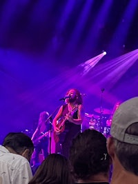 a group of people on stage at a concert