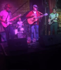 image may contain person, on stage, playing a musical instrument and night