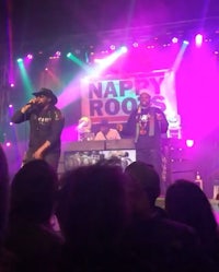 a group of people on stage at a concert