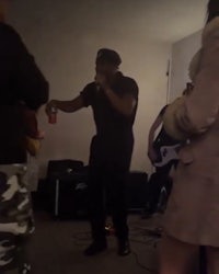 a group of people in a room playing music