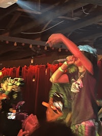 a group of people on stage at a concert