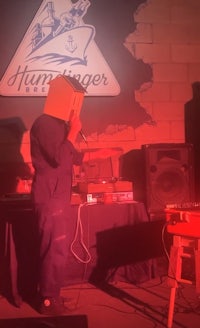 a man standing on stage with a microphone in front of him