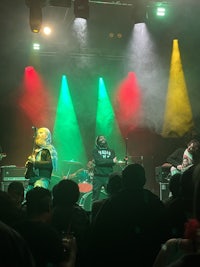 a group of people on stage at a concert